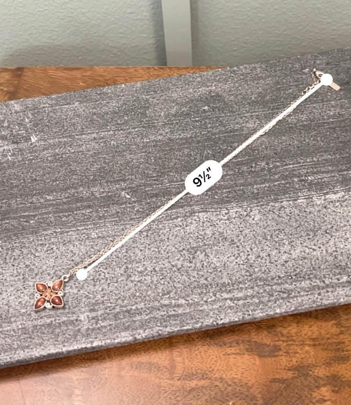 1928 Jewelry Company Silver Tone Quatrefoil Pendant Necklace with Amber Glass