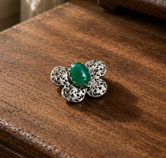 Mid-Century Vintage Silver-Tone Filigree Butterfly Brooch with Vibrant Green Glass Cabochon