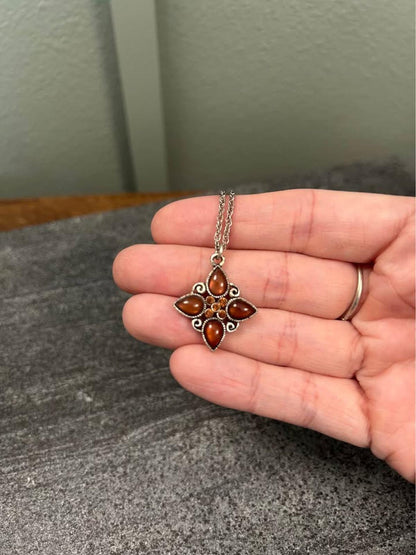 1928 Jewelry Company Silver Tone Quatrefoil Pendant Necklace with Amber Glass
